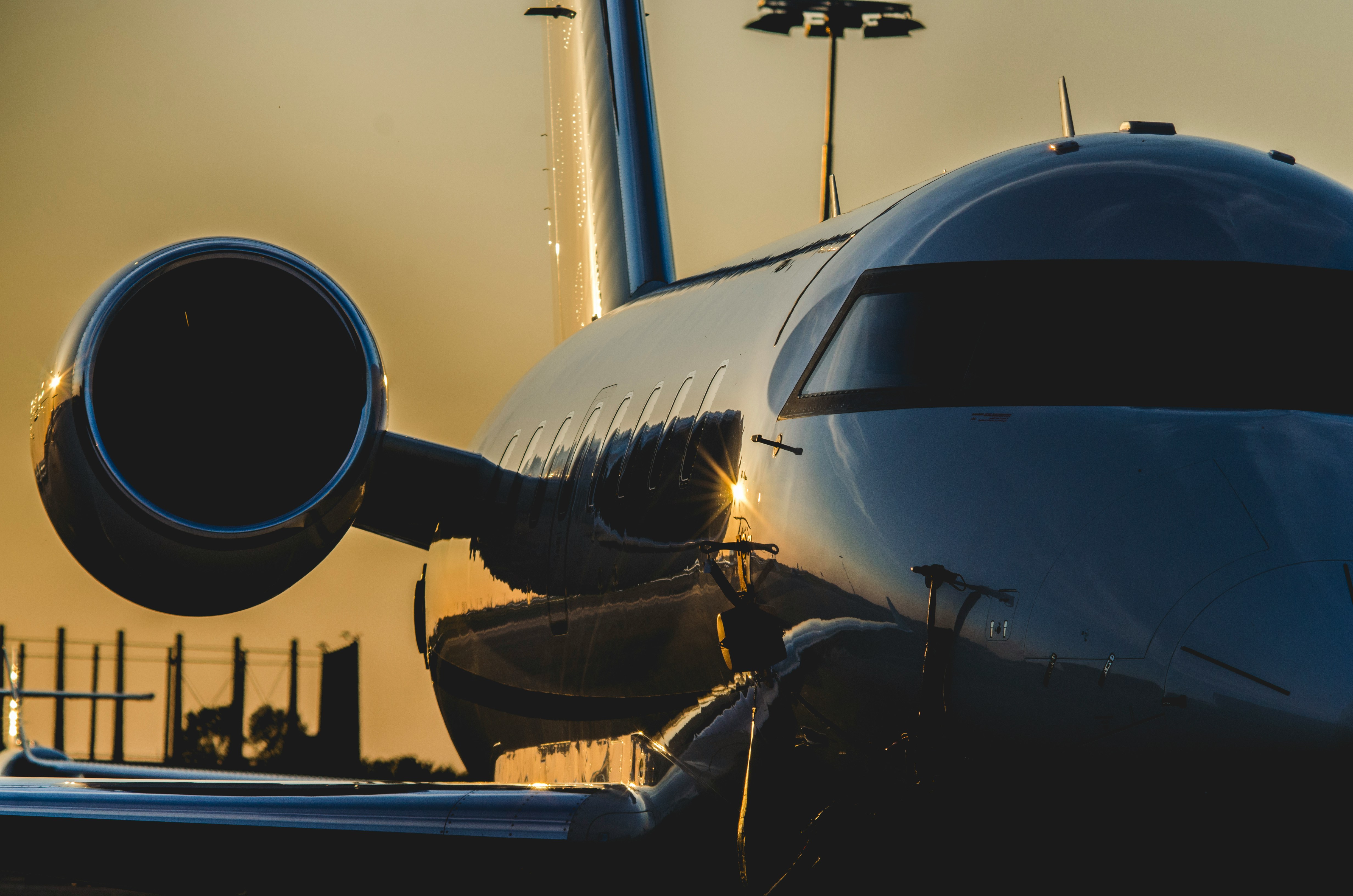 Private jet on the tarmac at sunset